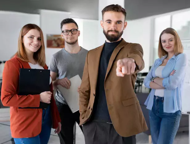 group-of-coworkers-at-the-office-posing-compressed-1